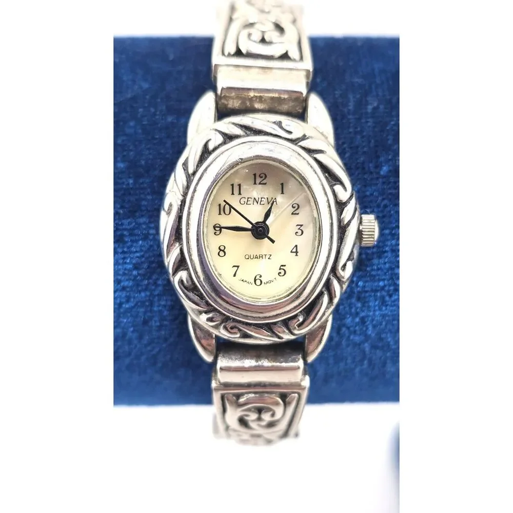 Woman's Geneva Silver Tone Oval Quartz Watch Ornate Bracelet Silver Tone